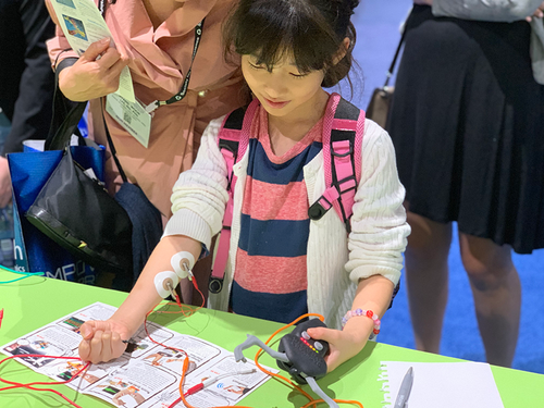Kid playing with science kit