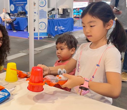 Kids playing with the claw science kit